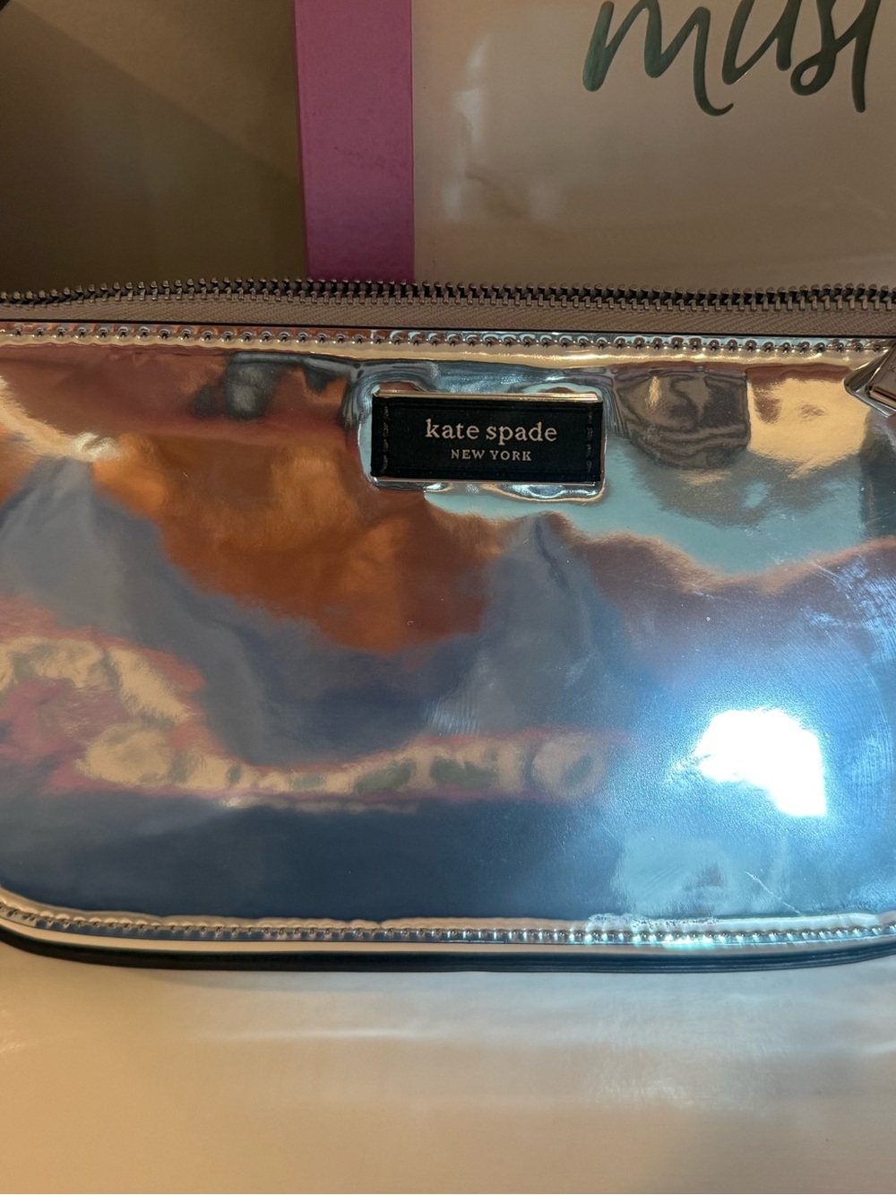 kate spade iridescent silver holographic clutch